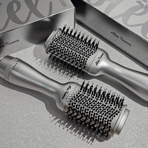 Compact blow dryer brush in steel silver