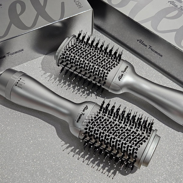 Compact blow dryer brush in steel silver